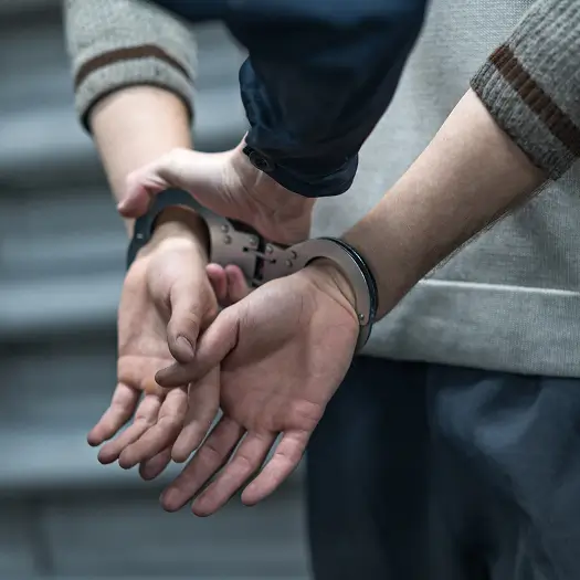 a person in handcuffs