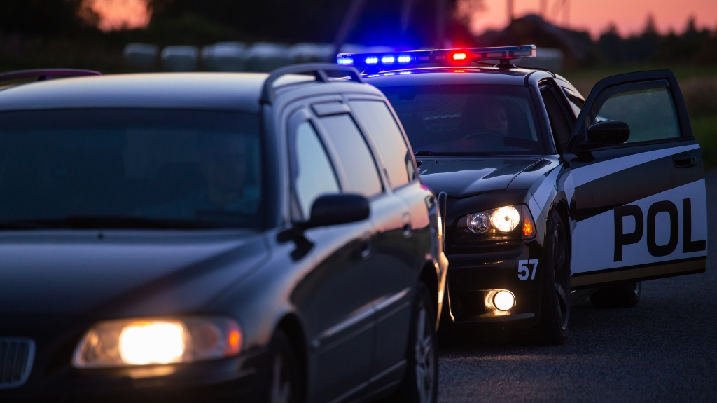 Patrol сar pulls over vehicle on the road