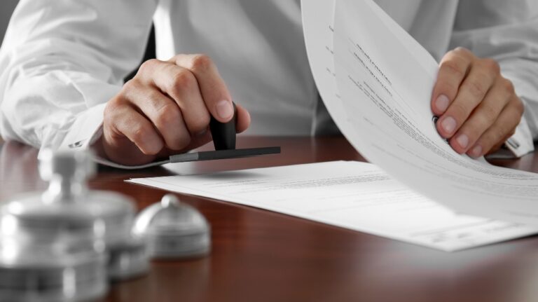 a man puts a stamp on documents