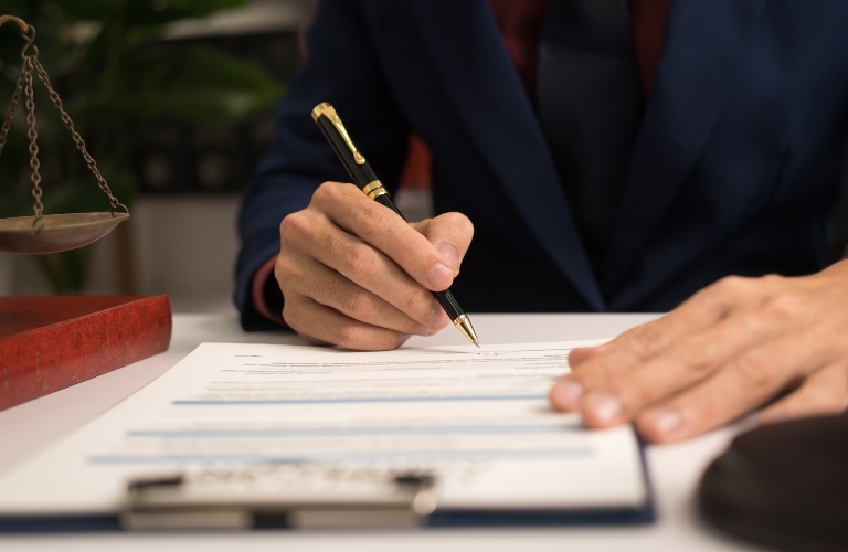 Male lawyer working with law book, A legal binding
