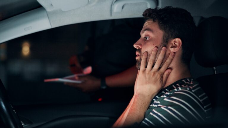 Traffic stop, man and stress in car with police