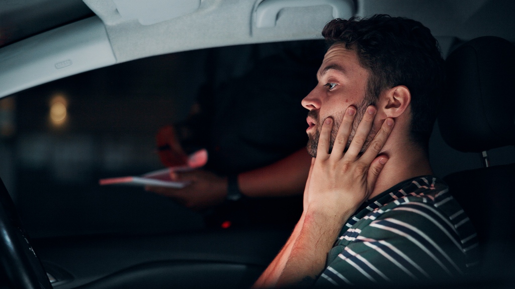 Traffic stop, man and stress in car with police